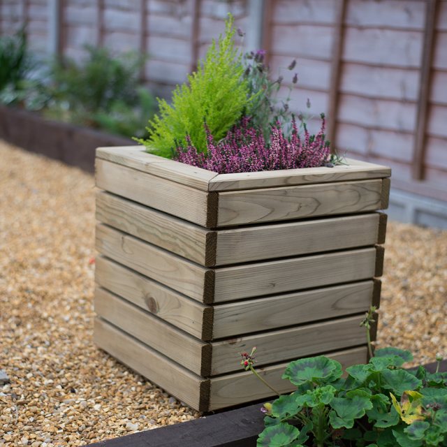 Forest Linear Planter - Square - Pressure Treated - displaying a plant