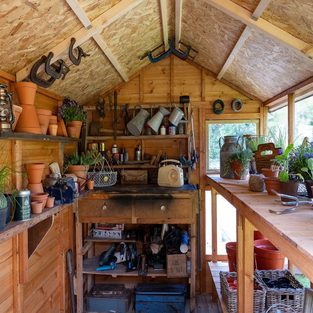 Forest Shiplap Potting Shed - wide shot showing the staging